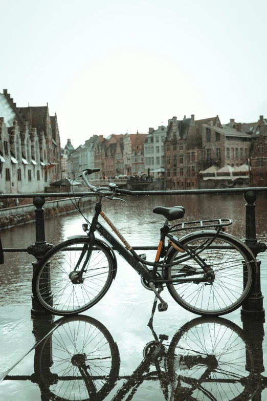 a bike is leaning up on the rail