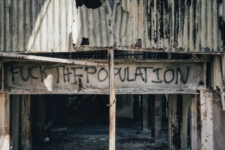 a long sign sitting on the side of a building