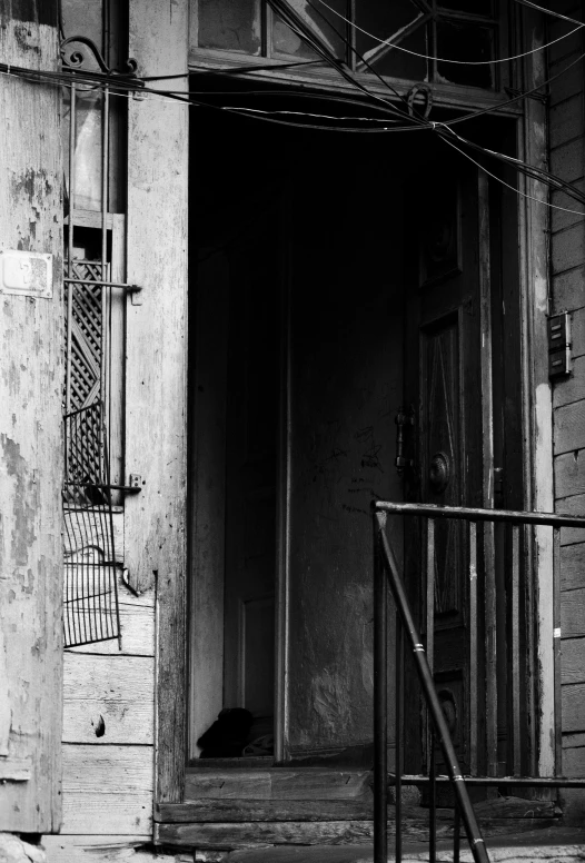 a set of steps leading up to a large doorway in the street