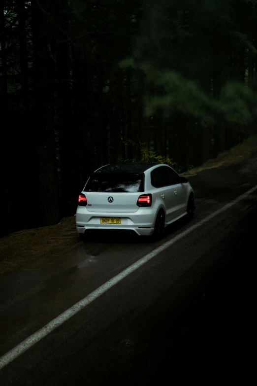 a white car parked on the side of the road