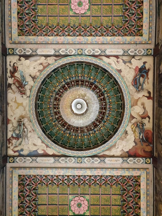a very fancy and ornate ceiling decoration on the building
