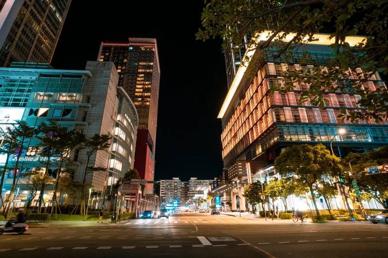 view down a street at night from an intersection