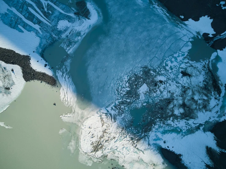 aerial view of an icy lake in the wilderness