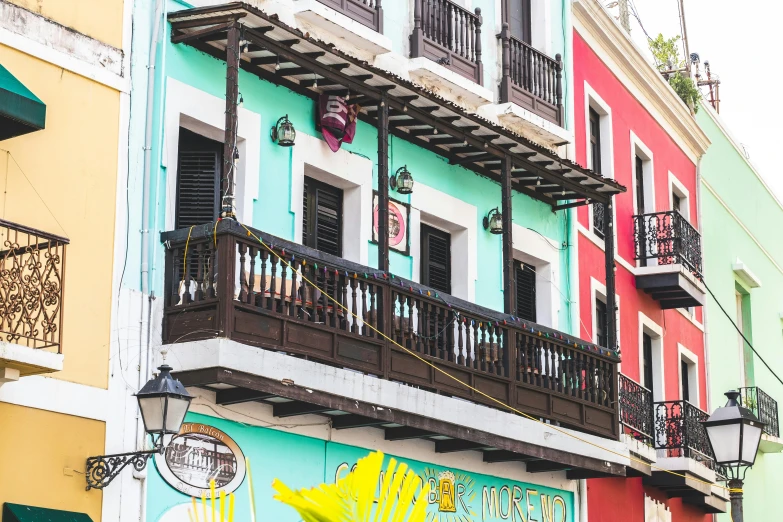 a street corner with a large store front on the sidewalk