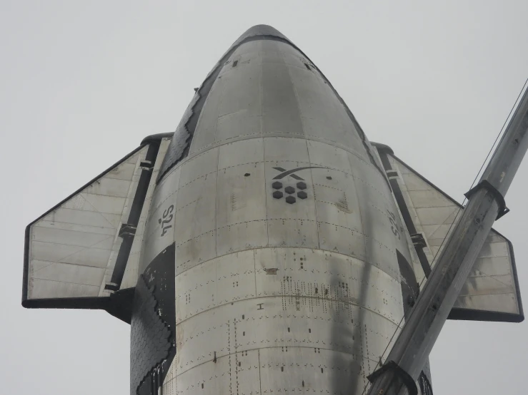 a airplane is seen from the bottom of the building