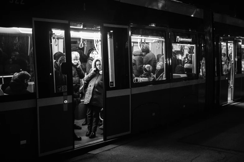 a group of people that are walking on a train