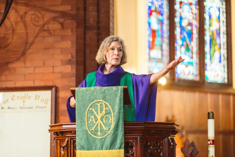 a woman is at the pulpit of a church