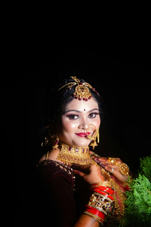 a woman wearing a golden necklace and a choker