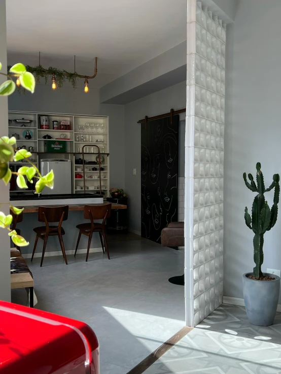 the entrance to a kitchen next to a dining room table