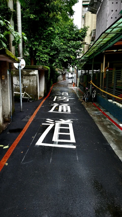 a street is lined with buildings and trees