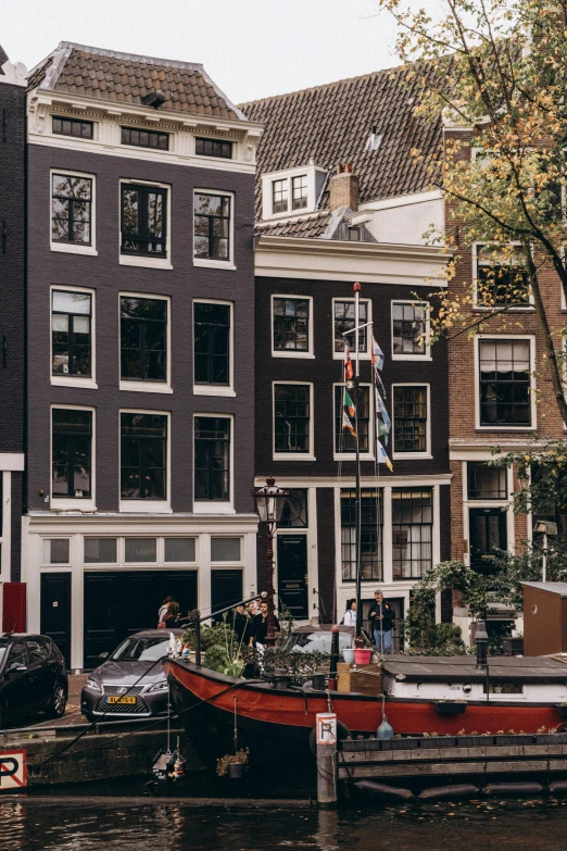 some boats parked next to some brown brick buildings