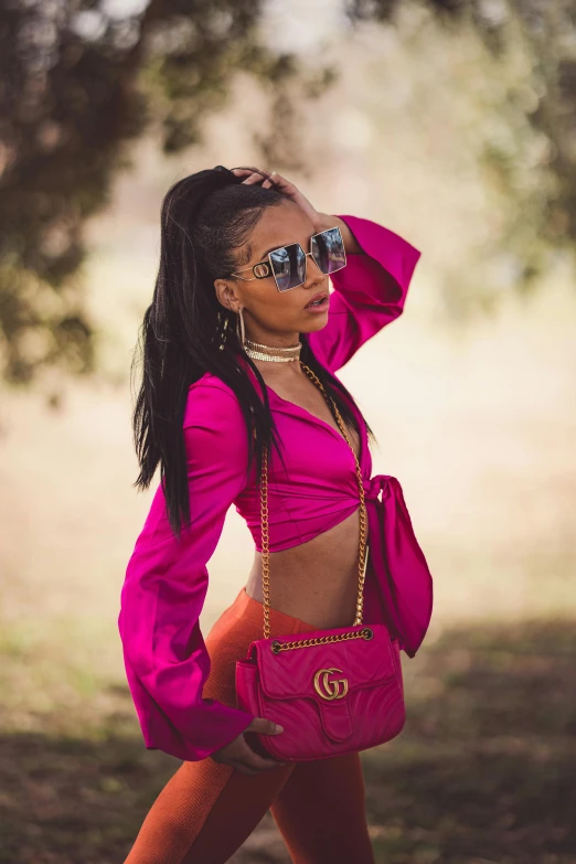 a woman with very large  in a pink outfit