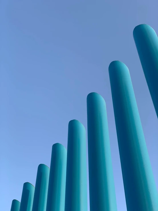 multiple posts form in the air against the blue sky