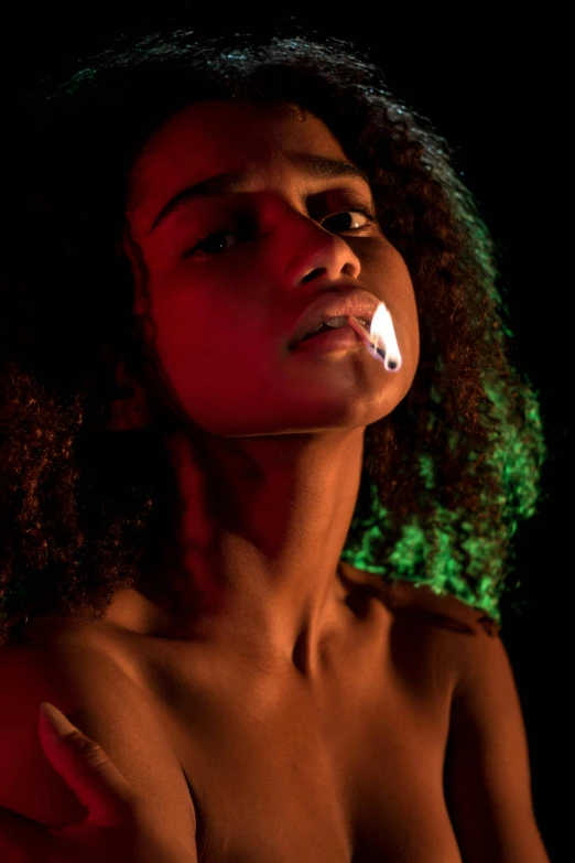 a woman in night light posing  with an electric nose plug