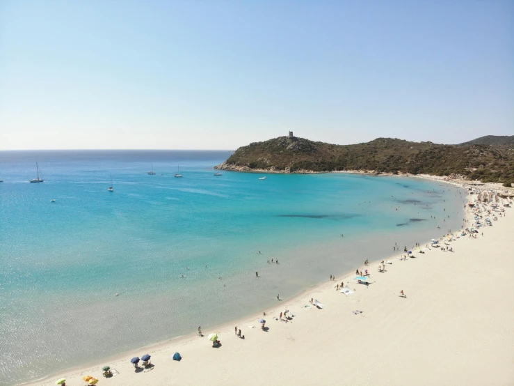 a beach with some very beautiful blue waters