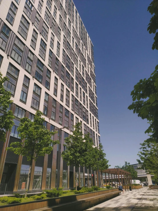 a very tall building with some trees in front of it