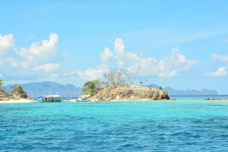 a group of boats floating on top of a body of water