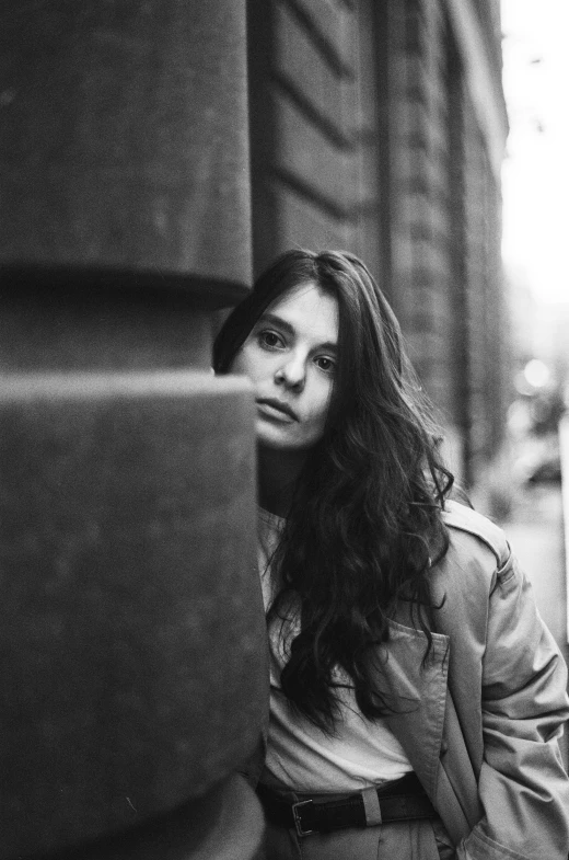 a beautiful young woman walking down a street