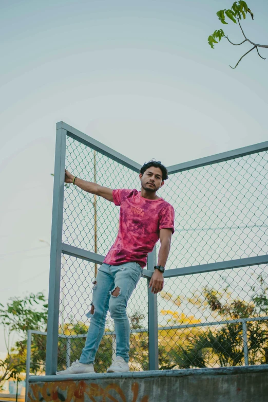 the young man is standing on top of a skateboard