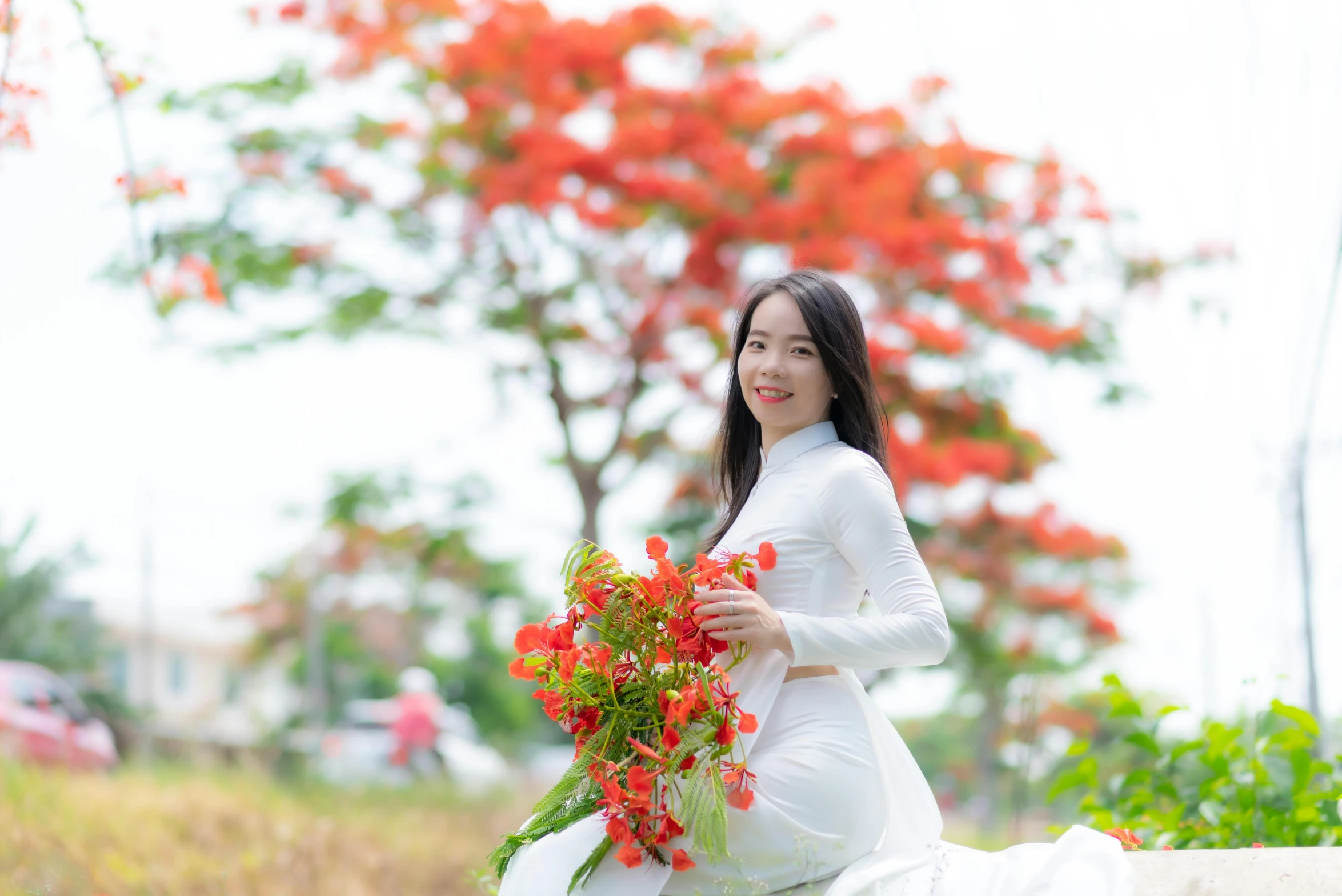 there is a woman that is holding flowers