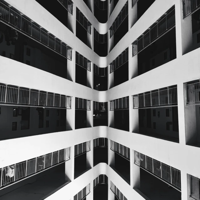 black and white pograph of tall building that looks like it has multiple stories