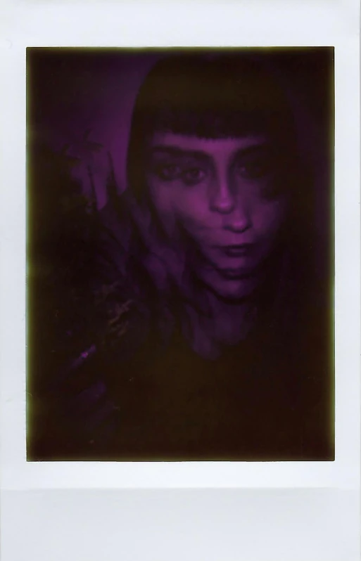 an image of a woman with her face in the dark