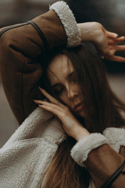 an image of a woman in a white jacket with long hair