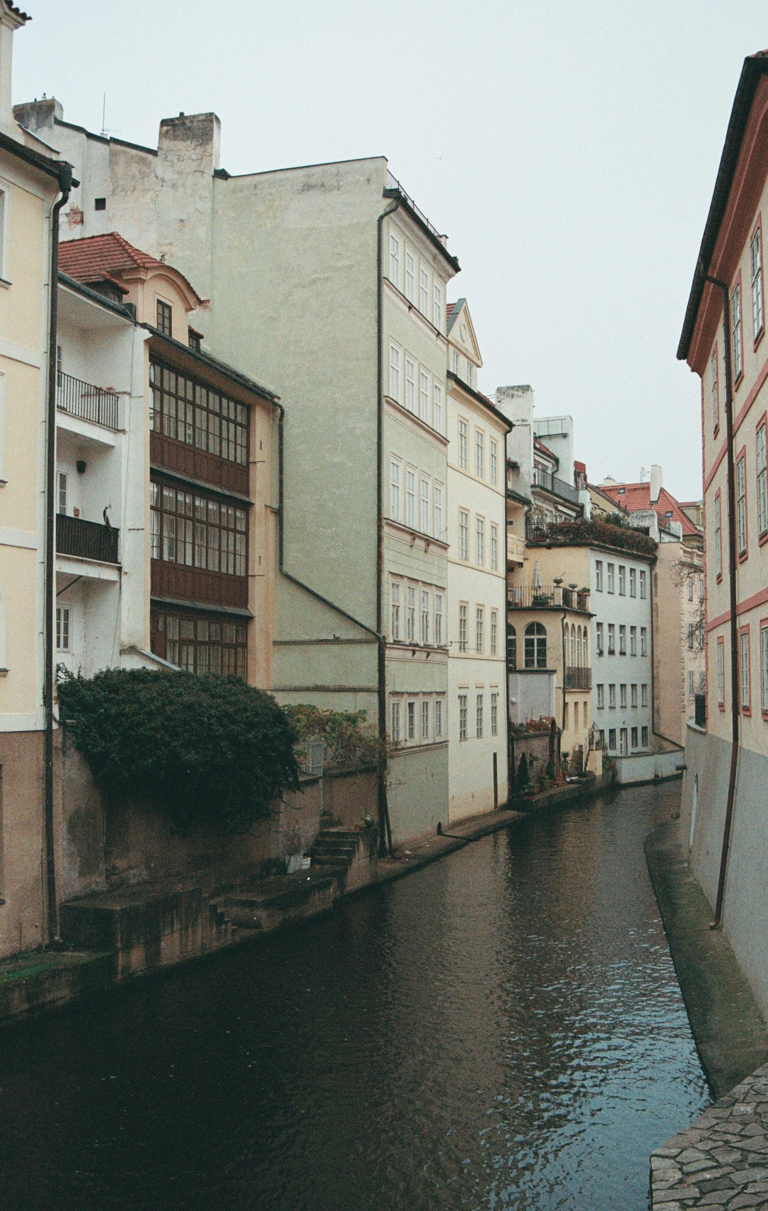 water is running through a narrow and old street