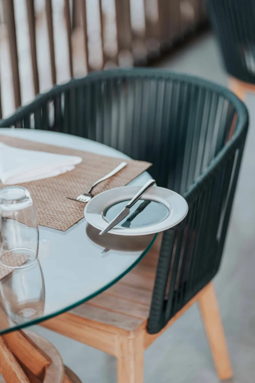 the dining table is set with glasses and silverware