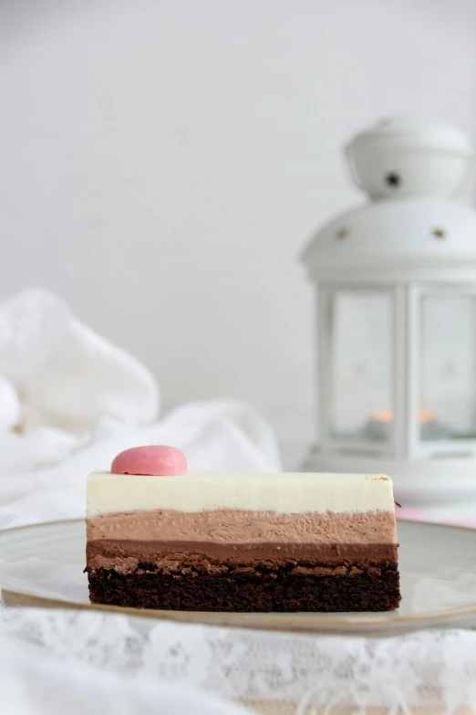 two pieces of chocolate cake sitting on a plate