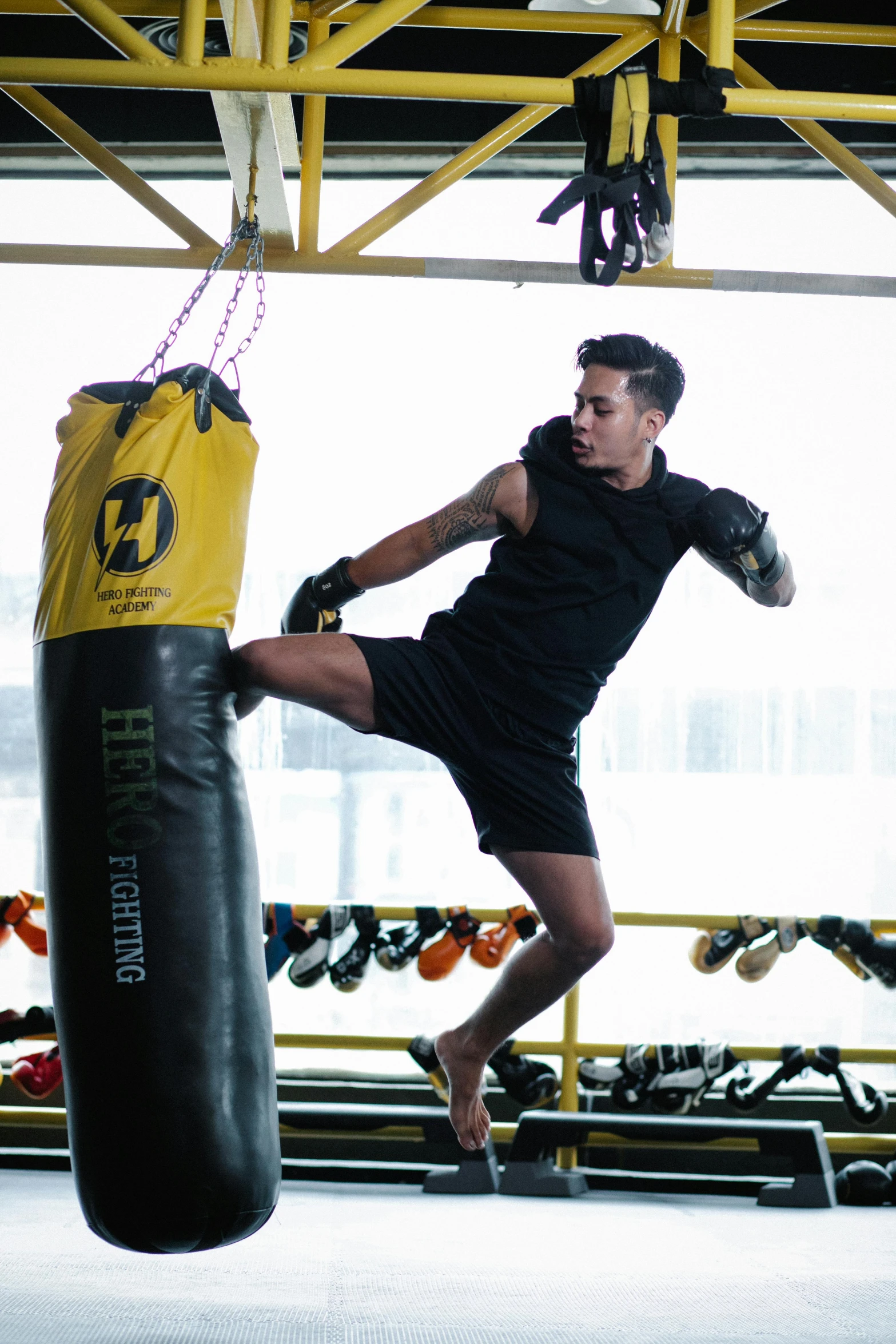 a young man kick punches in the gym