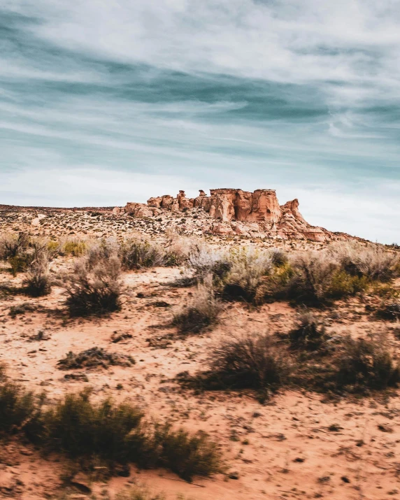 there is a huge rock formation in the middle of the desert