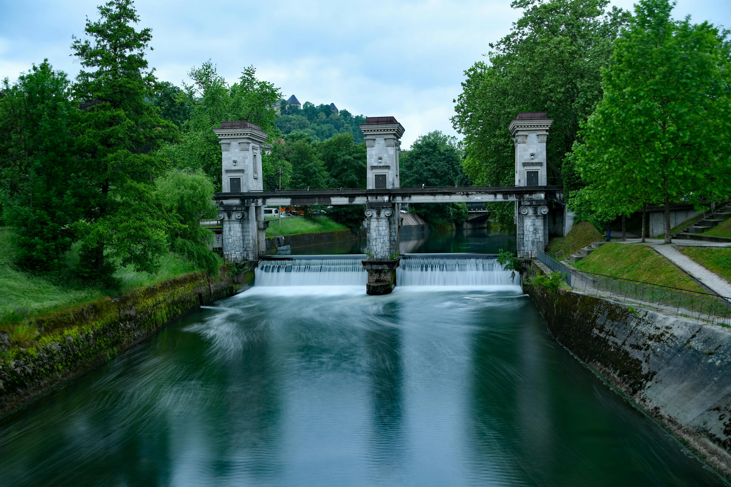 a long stretch of water that has some towers on top of it