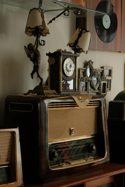 a po of an old fashion radio with clocks