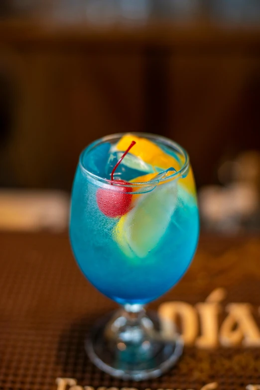 a colorful drink on the table in a restaurant
