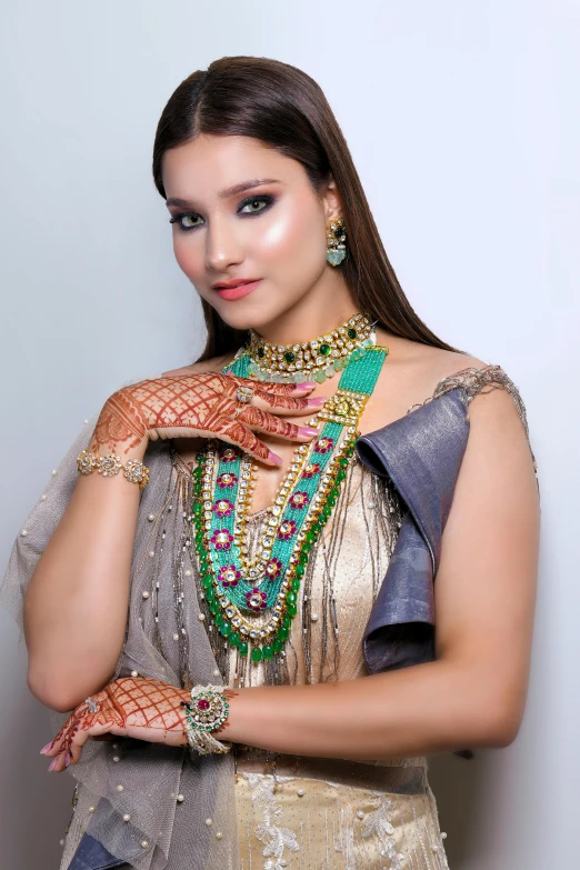 a girl with some fancy jewelry on her hand