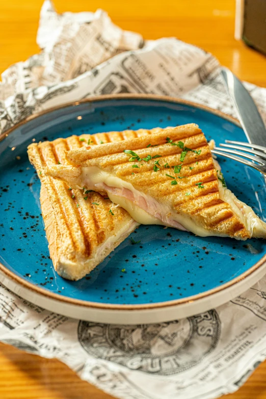 a sandwich on a plate is shown with a fork