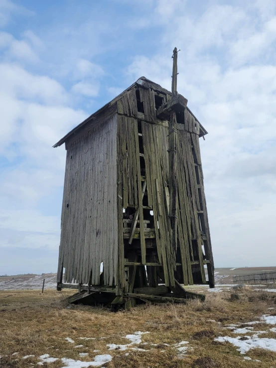 a run down and weathered out building is shown