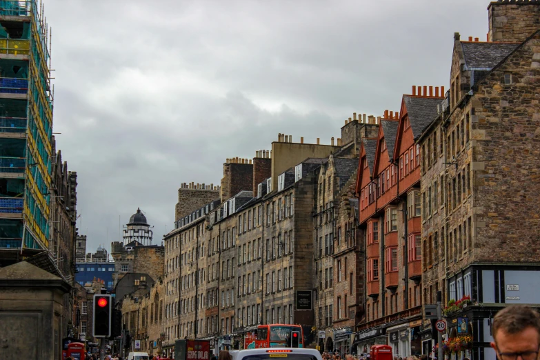 an old city street scene has several buildings lining the way