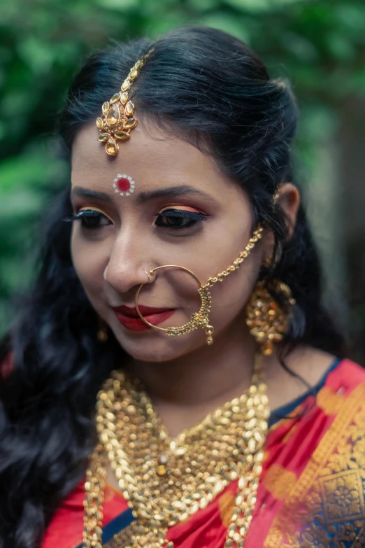 an image of a girl that has jewelry on her face