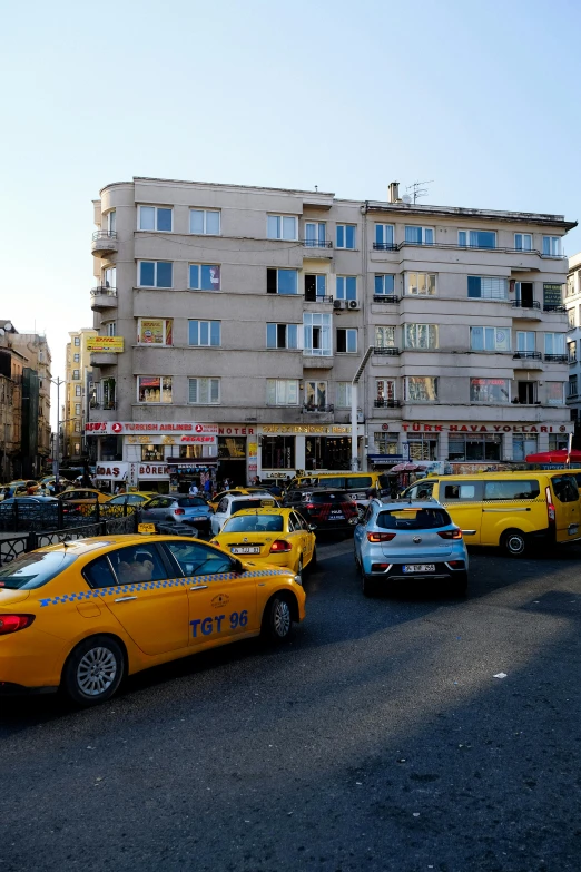 a group of taxis stopped at a stop light