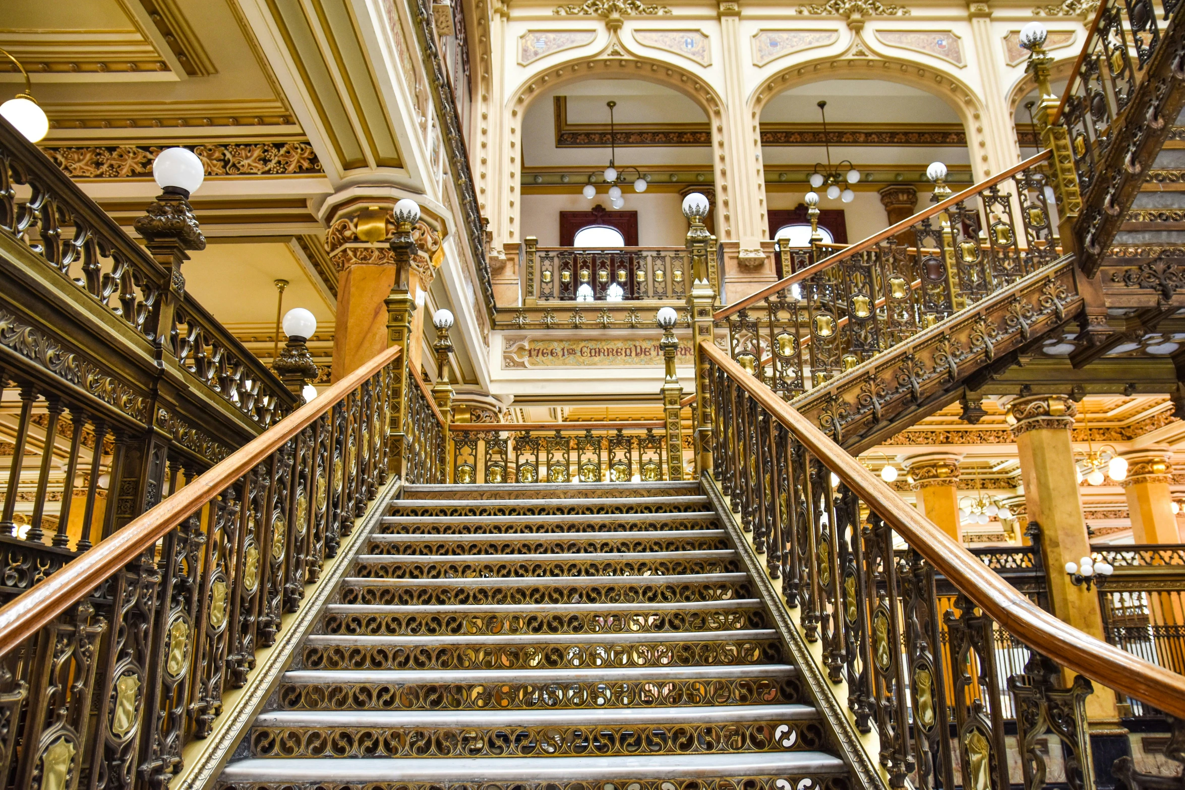 an elaborate staircase inside a large building