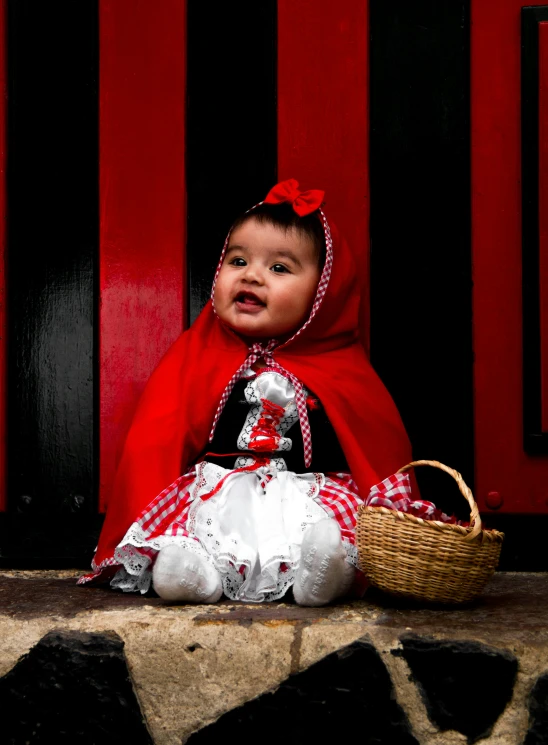 a young child with a basket on the ground