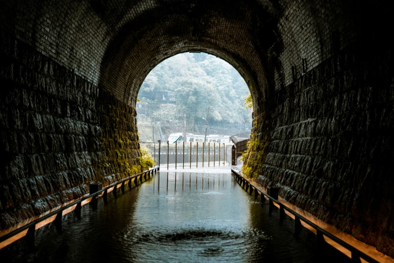 water in the dark tunnel, with a path going through
