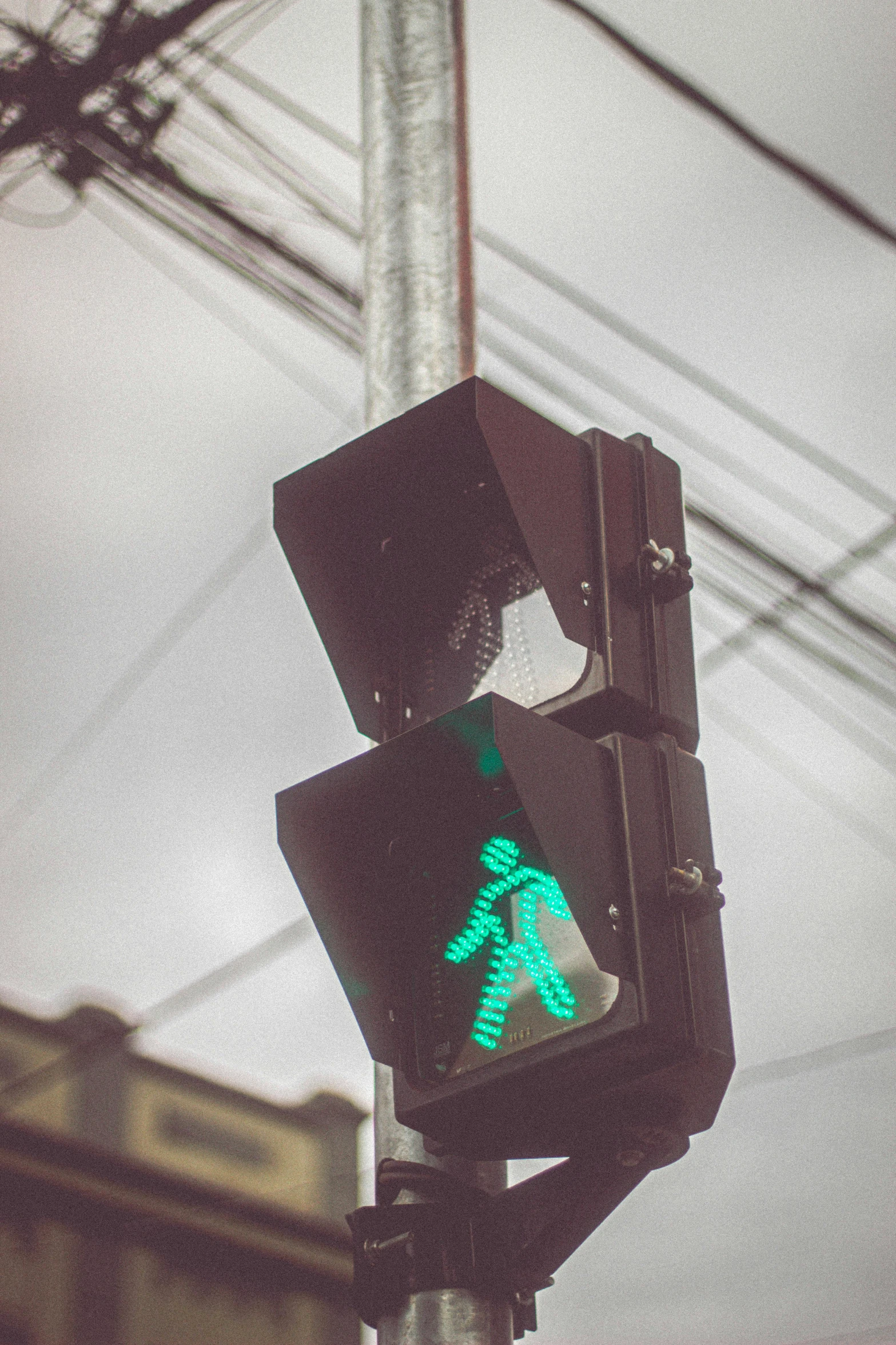 a traffic light that has a green walk symbol on it