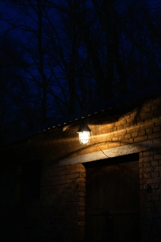 a building with a light on and a door way