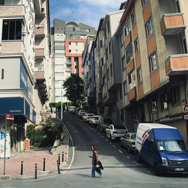 two woman walking down a very large city street