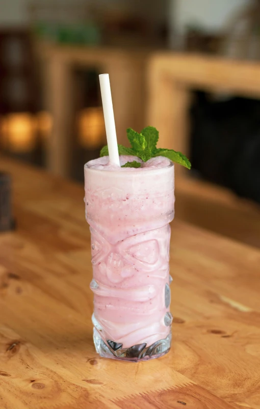 a drink sitting on top of a wooden table