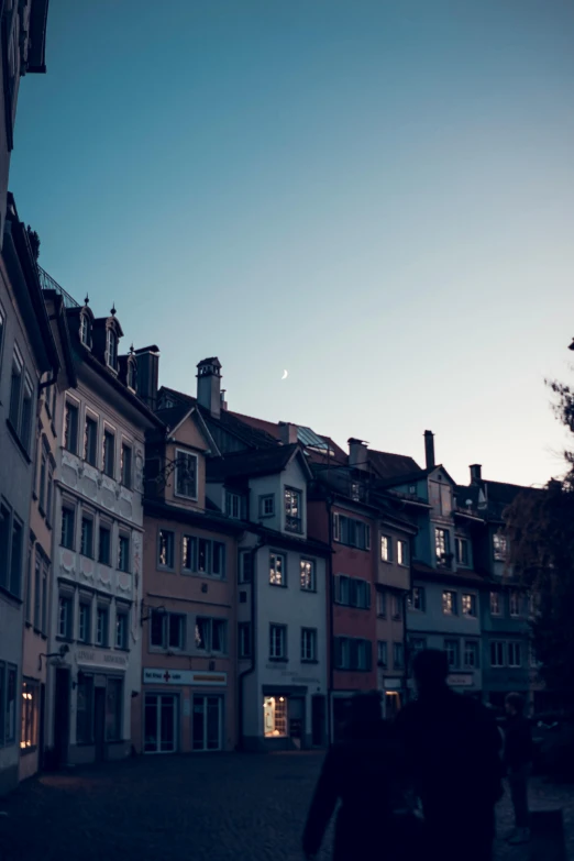 old town at dusk showing a couple walking