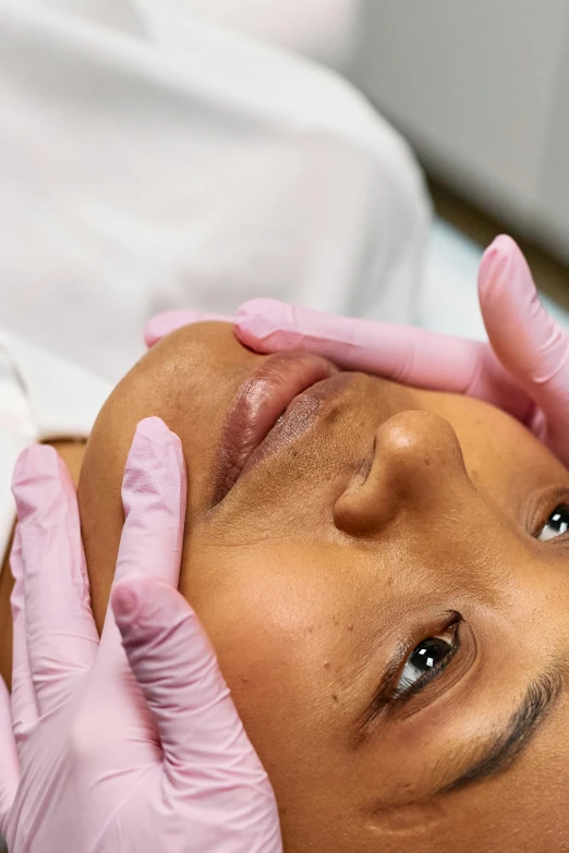 a close up of a person getting a facial lift